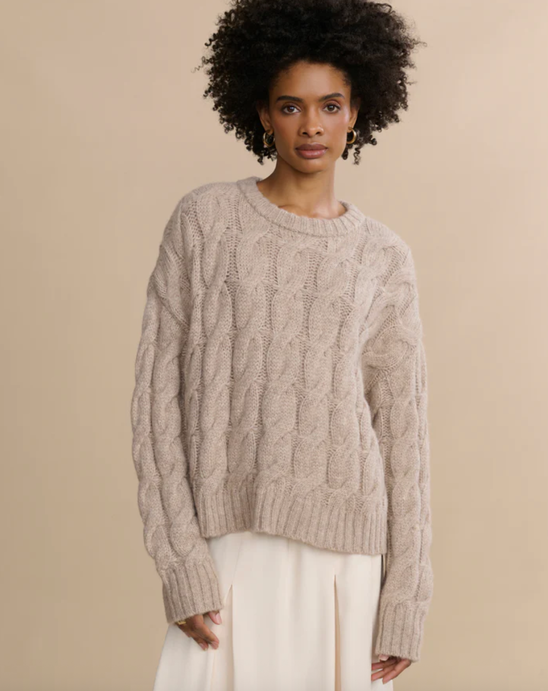 Model wearing cable knit Serena crewneck